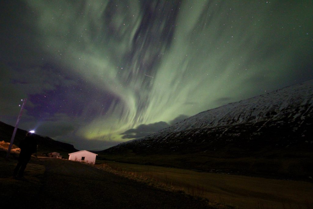 Northern lights above the observatory at the Wilderness Center in East Iceland